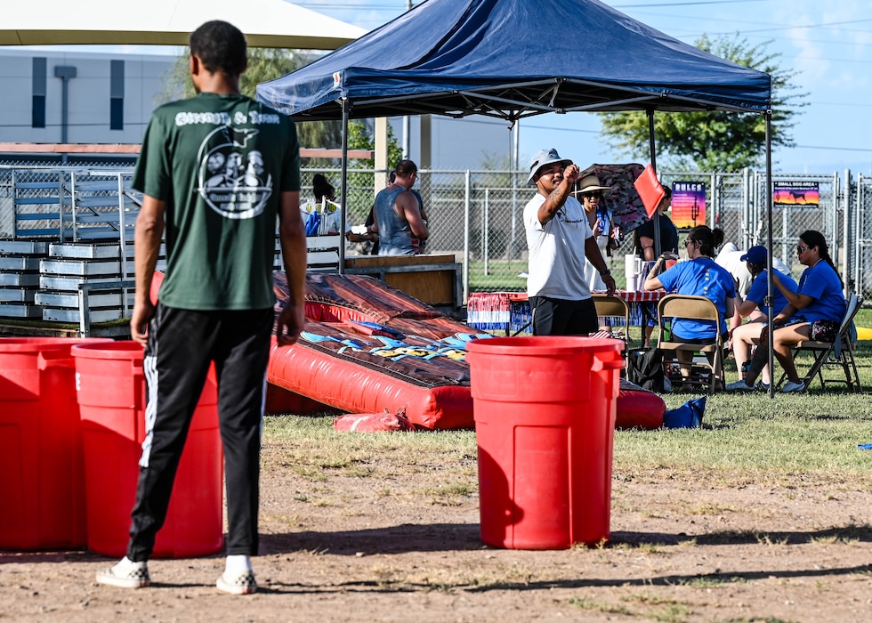 Luke Air Force Base community members play cornhole at the 2025 Freedom Fest, July 3, 2025, at Luke AFB, Arizona.
