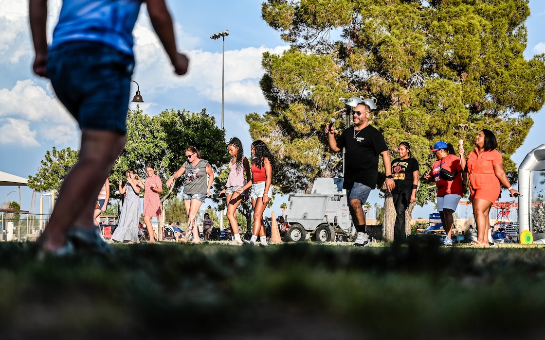 Luke Air Force Base community members sing together at the 2025 Freedom Fest, July 3, 2025, at Luke AFB, Arizona.