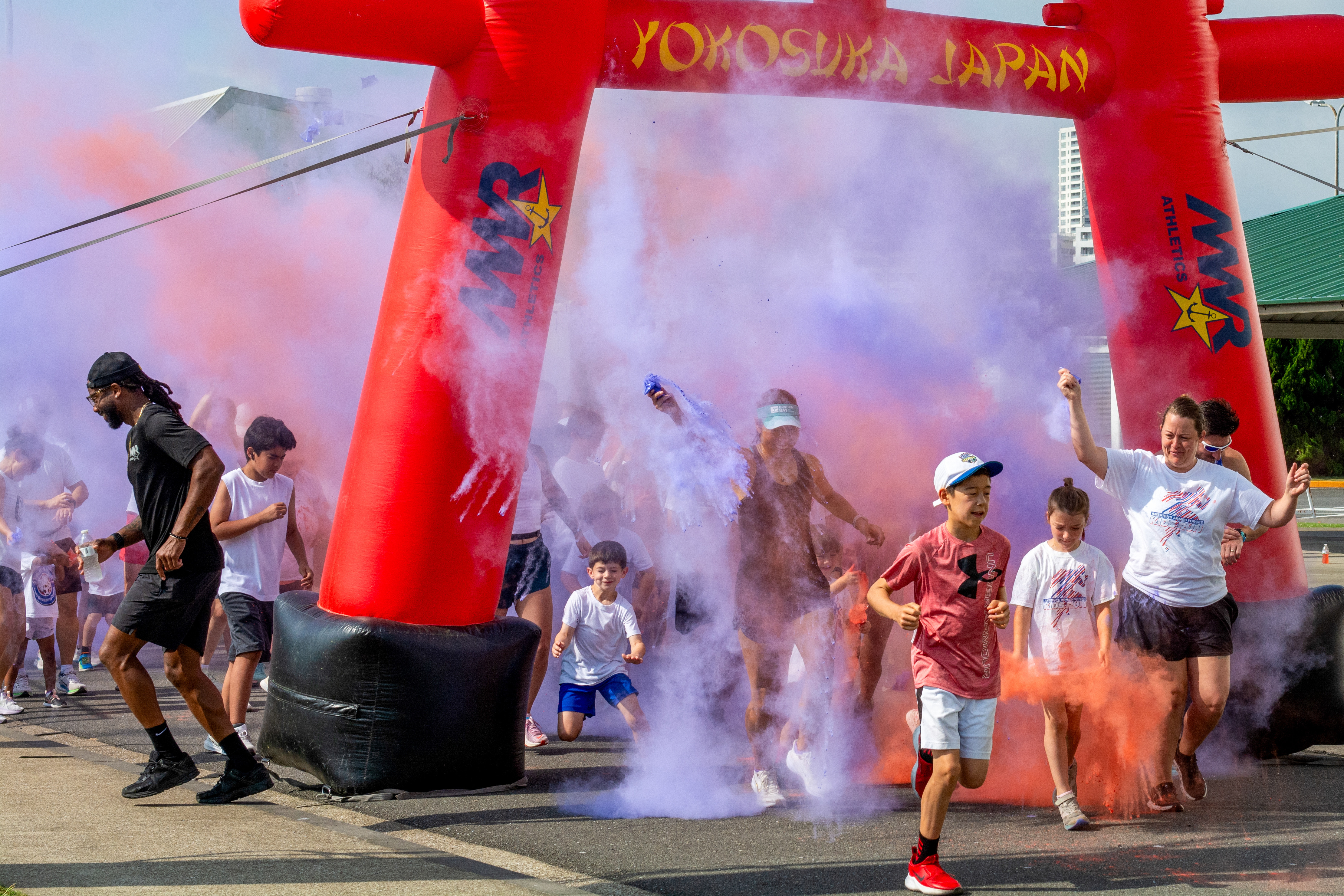 Commander Fleet Activities, Yokosuka families participate in a 4th of July color run. This fun run kicks off a number of special Independence Day events hosted by CFAY MWR.