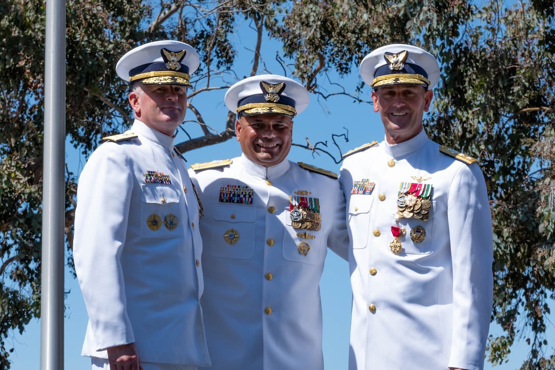 U.S. Coast Guard Rear Adm. Jeffrey Novak, commander Southwest District, Vice Adm. Andrew Tiongson, commander Pacific Area, and Rear Adm. Joseph Buzzella pose for a photo during a change-of-command ceremony at Coast Guard Island in Alameda, Calif. July 8, 2025.