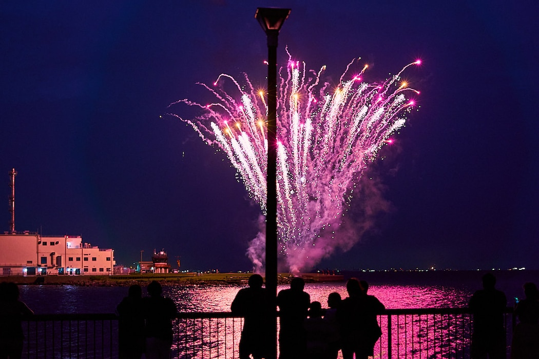 A small group watches Independence Day fireworks launching over Chess Romeo in Yokosuka, Japan July 4, 2025