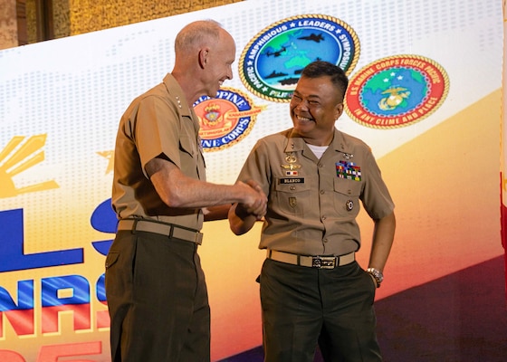 U.S. Marine Corps Lt. Gen. James Glynn, left, commander, U.S. Marine Corps Forces, Pacific, shakes hands with the 37th Commandant of the Philippine Marine Corps, Maj. Gen. Vicente Blanco, following the conclusion of the opening ceremony of the 11th iteration of the Pacific Amphibious Leaders Symposium, Manila, Philippines, July 8, 2025. Bringing together experts and leaders from across the Indo-Pacific, PALS fosters collaboration among Allied and partner amphibious and maritime forces to share knowledge and recent operational insights. This year’s symposium hosted senior leaders from 22 participating nations who are committed to a free and open Indo-Pacific, with the objective of strengthening and developing regional relationships. (U.S. Marine Corps photo by Lance Cpl. Moses S. Lopez Franco)