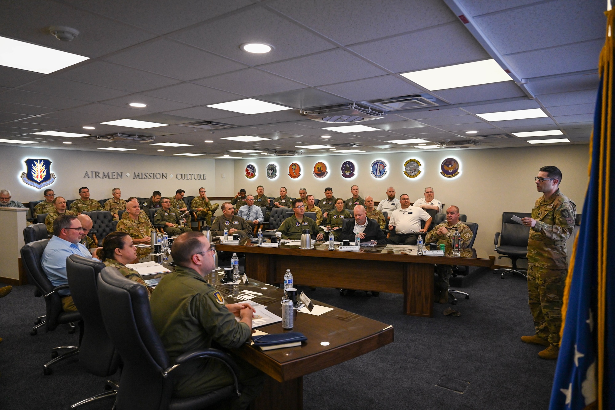 Leadership from the 97th Air Mobility Wing and members of the Air Education and Training Command Inspector General team sit in a meeting at Altus Air Force Base, Oklahoma, June 6, 2025. This meeting was held as part of the first Combat Readiness Inspection for the Air Education and Training Command. (U.S. Air Force photo by Airman 1st Class Lauren Torres)