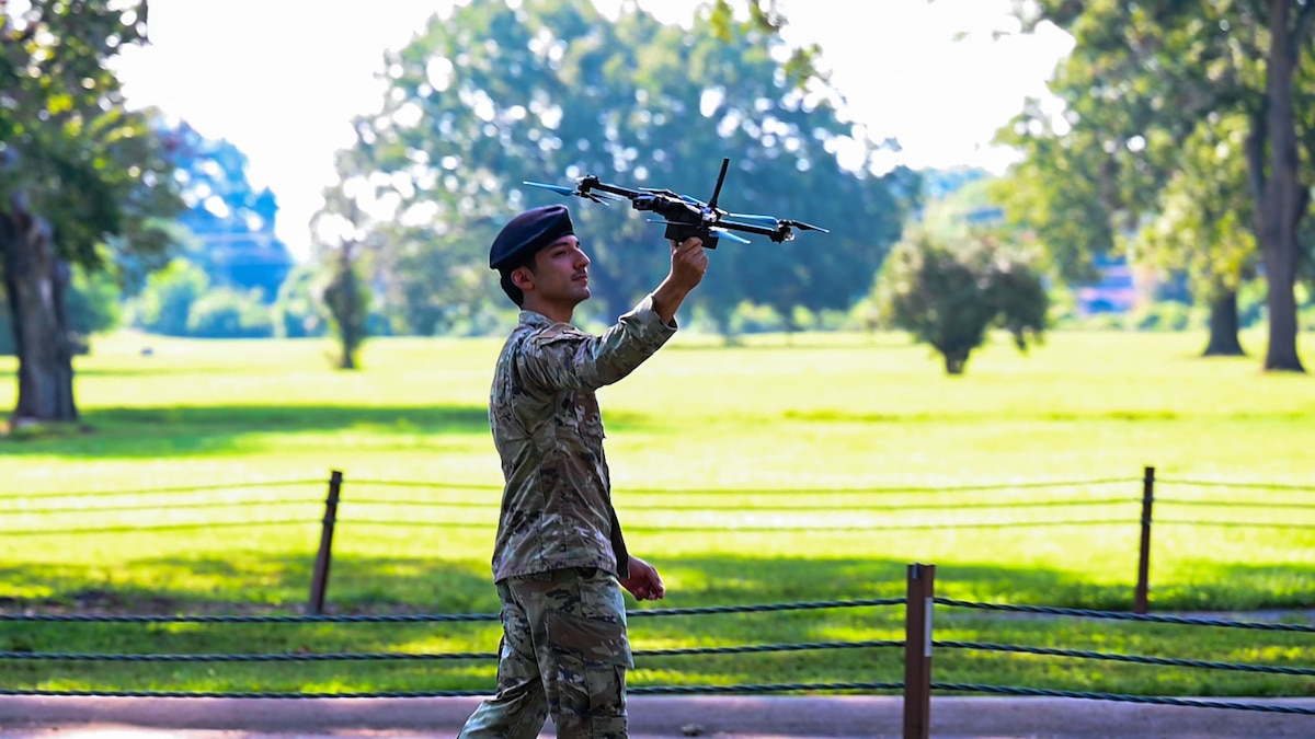 U.S. Air Force Senior Airman Anthony Cruz, 2nd Security Forces Squadron electronic warfare airman, catches a drone during a demonstration at Barksdale Air Force Base, Louisiana, September 3, 2024.