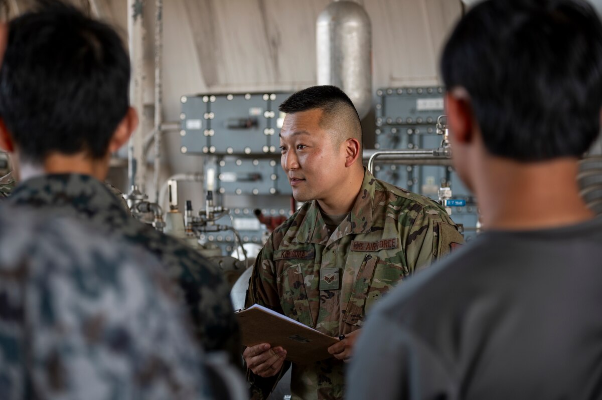 U.S. Air Force Senior Airman Tadayoshi Kiriyama, 35th Maintenance Squadron aerospace ground equipment journeyman, translates for Japan Air Self-Defense Force members during training to prepare for exercise Resolute Force Pacific 2025 at Misawa Air Base, Japan, July 8, 2025. Bilateral partnership enables unparalleled results in maintaining a free and open Indo-Pacific region. (U.S. Air Force photo by Senior Airman Brittany Russell)