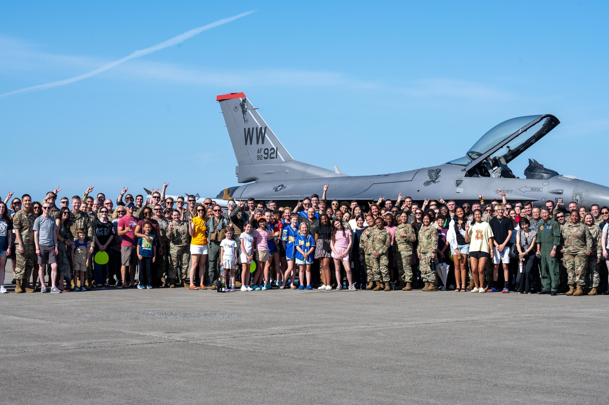 U.S. Air Force Col. Matthew Kenkel, 35th Fighter Wing deputy commander, poses for a group photo with his final, or fini, flight celebration attendees.