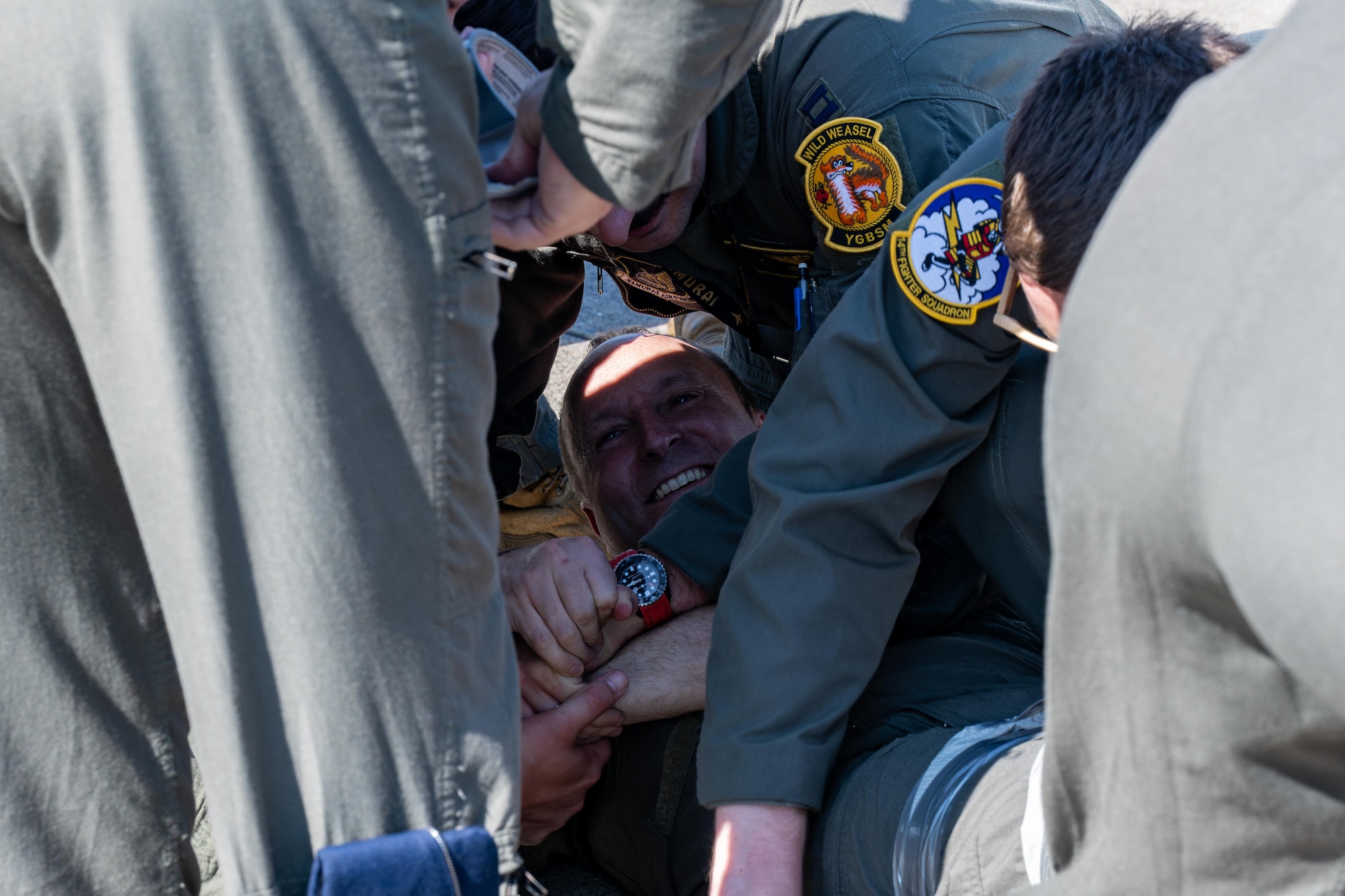 U.S. Air Force Col. Matthew Kenkel, 35th Fighter Wing deputy commander, is bound with duct tape by fellow pilots assigned to the 35th Fighter Wing during his final, or fini, flight celebration.