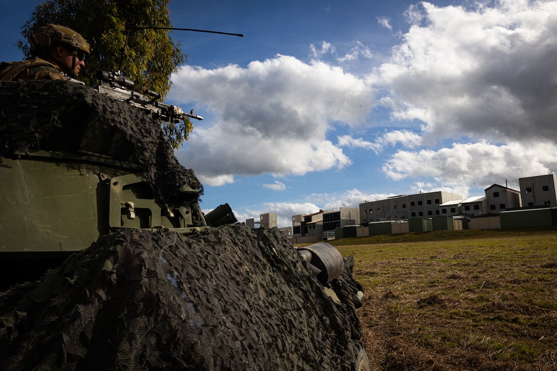 U.S. Marine Corps 1st Lt. Joseph Kiesa, an infantry officer with 1st Light Armored Reconnaissance Company, Battalion Landing Team 1st Battalion, 7th Marine Regiment, 31st Marine Expeditionary Unit, fires a M240B machine gun during a force on force exercise at Shoal Water Bay Training Area, Queensland, Australia, July 5, 2025. Marines participated in this training in order to refine their lethality and interoperability against one another. The 31st MEU is operating aboard ships of the USS America Amphibious Ready Group in the 7th Fleet area of operations, the U.S. Navy’s largest forward-deployed numbered fleet, and routinely interacts and operates with allies and partners in preserving a free and open Indo-Pacific region. Kiesa is a native of New York. (U.S. Marine Corps photo by Lance Cpl. Raul Sotovilla)