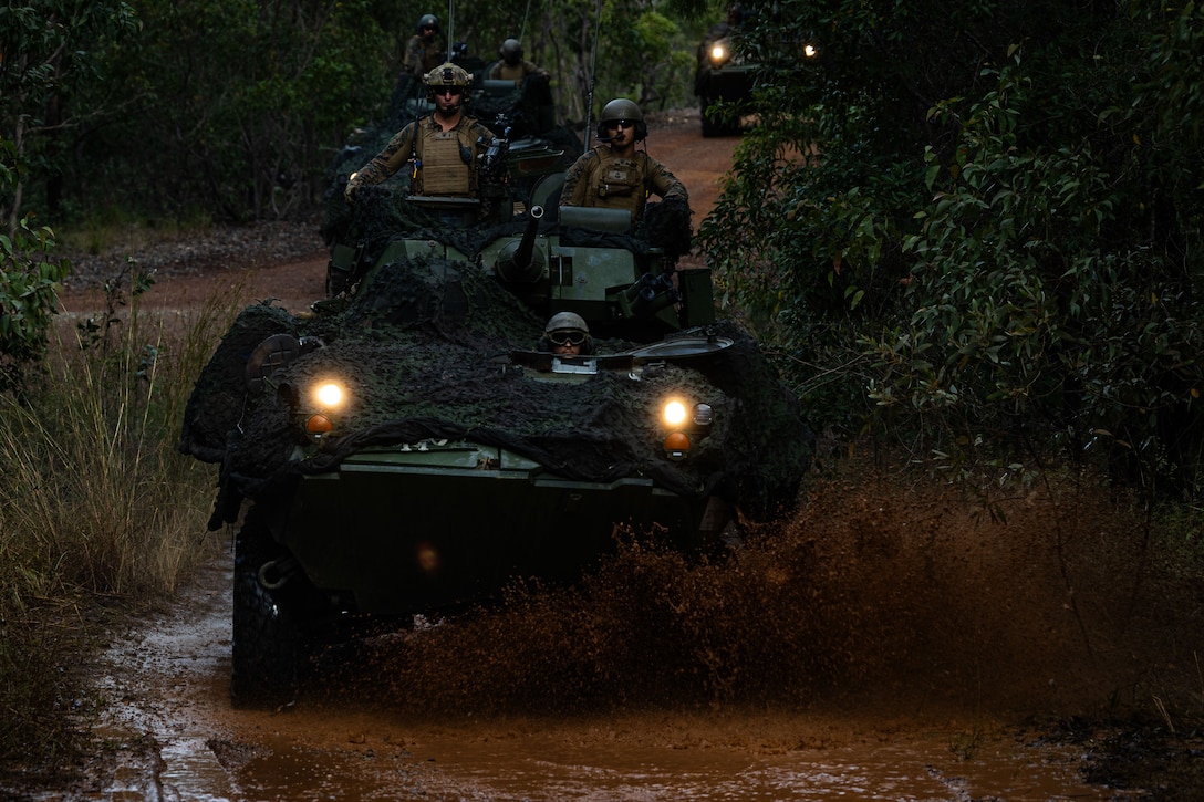 U.S. Marines with 1st Light Armored Reconnaissance Company, Battalion Landing Team 1st Battalion, 7th Marine Regiment, 31st Marine Expeditionary Unit, conduct a patrol on Light Armored Vehicles during a R-80D Sky Raider drone familiarization exercise at Shoal Water Bay Training Area, Queensland, Australia, June 30, 2025. Marines enhanced their reconnaissance capabilities through the use of an unmanned aerial observational device. The 31st MEU is operating aboard ships of the USS America Amphibious Ready Group in the 7th Fleet area of operations, the U.S. Navy’s largest forward-deployed numbered fleet, and routinely interacts and operates with allies and partners in preserving a free and open Indo-Pacific region. (U.S. Marine Corps photo by Lance Cpl. Raul Sotovilla)