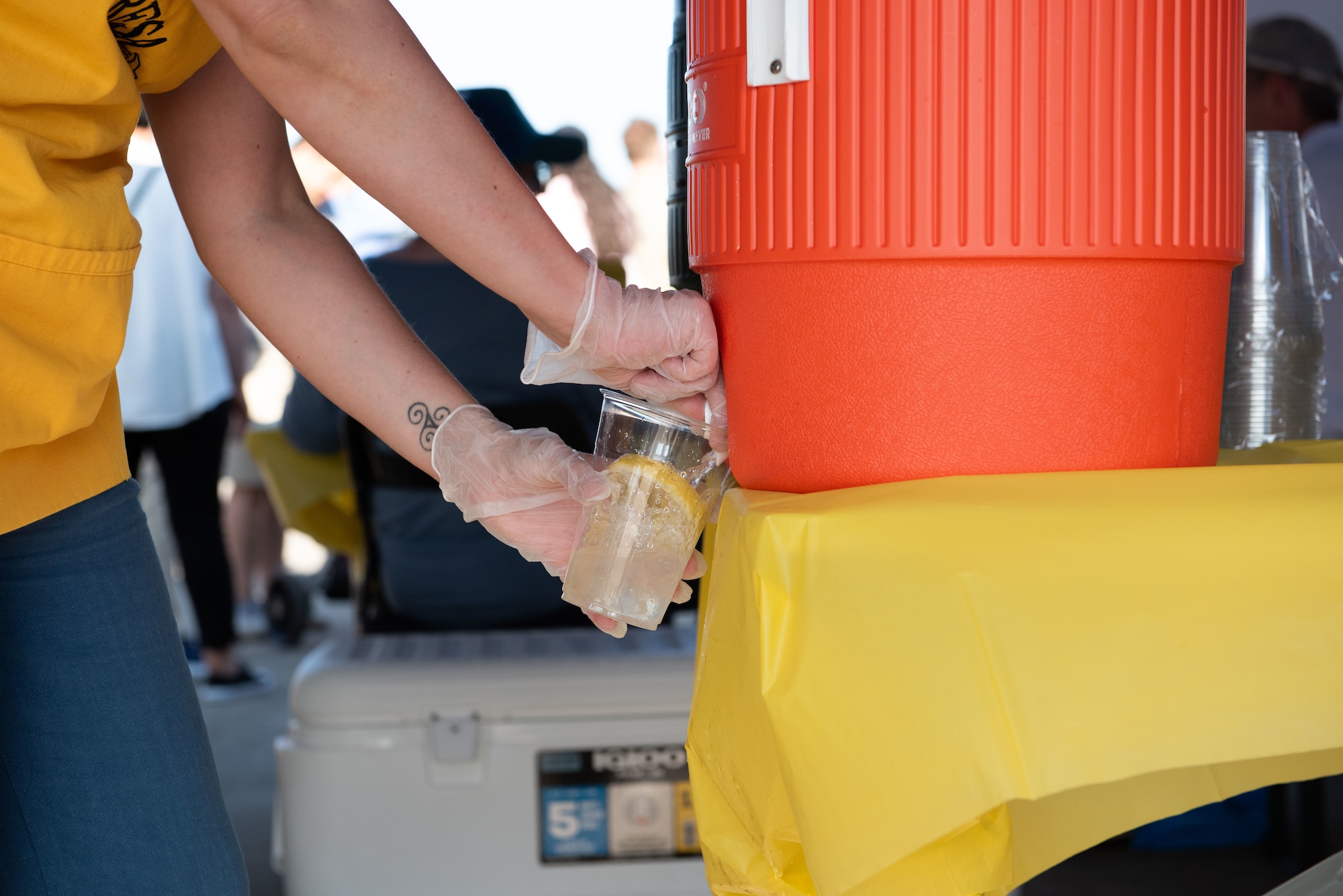 A Freedom and Friendship Fest volunteer pours lemonade for attendees to help combat the warm weather at Ramstein Air Base, Germany, July 3, 2025.