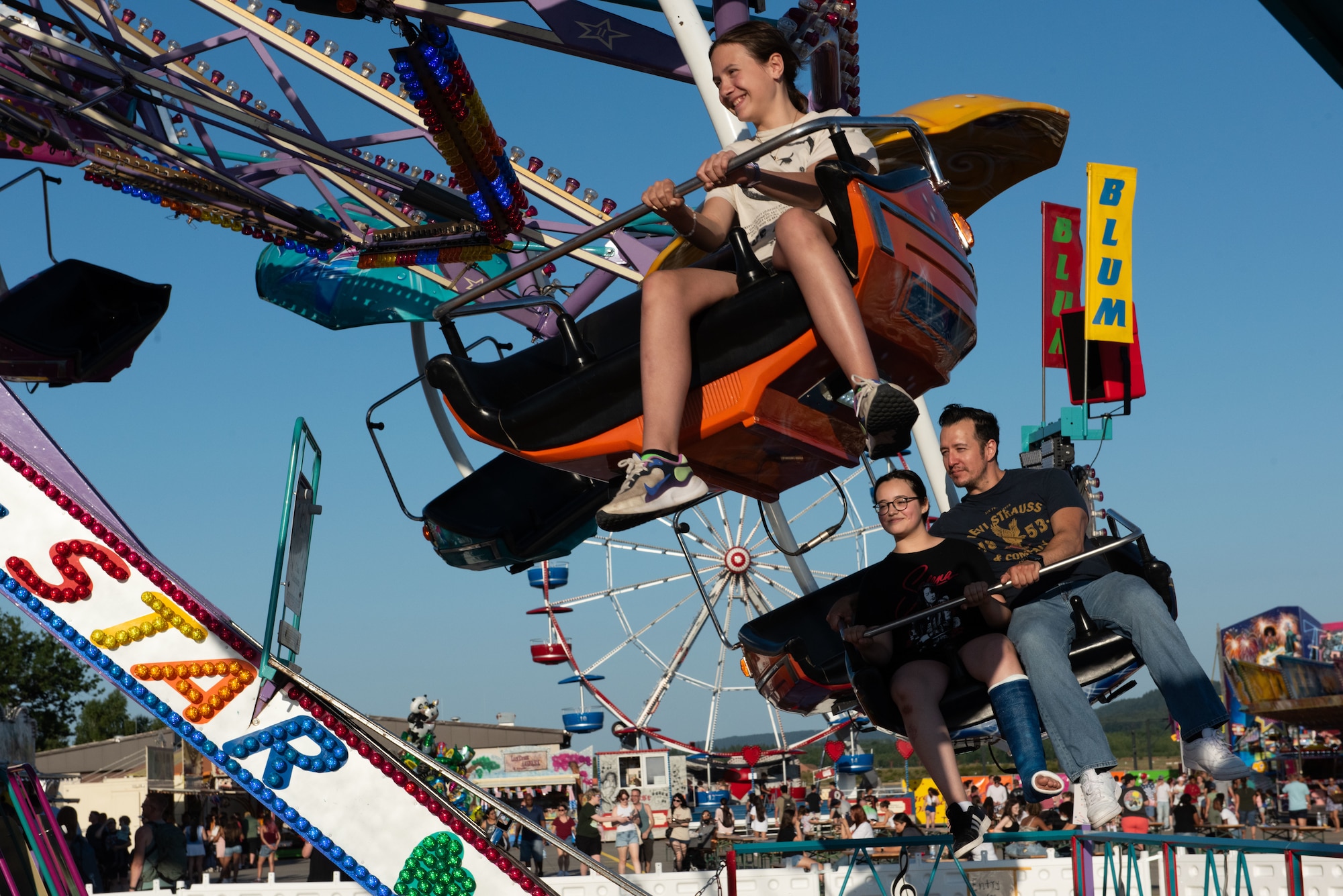 Freedom and Friendship Fest attendees enjoy carnival rides at Ramstein Air Base, Germany, July 3, 2025.