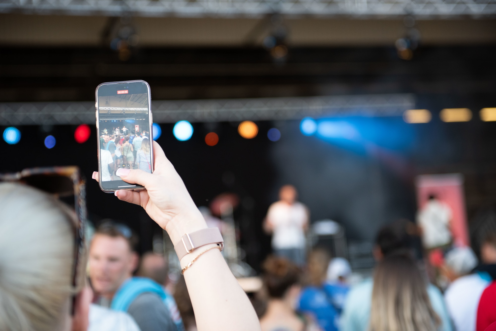 A Freedom and Friendship Fest attendee records musical group, AWOLNATION, during their performance at Ramstein Air Base, Germany, July 3, 2025.