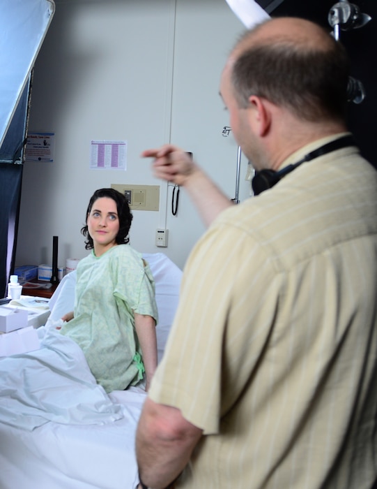 150417-N-ME988-015 NORTH CHICAGO, Ill. (April 17, 2015) Amy Leigh Abelson (left), cast in the role of a victim of sexual assault, listens to Kurt Uebersax (right), from KJU Productions LLC, during a Sexual Assault Forensic Examination (SAFE) scene rehearsal at the Captain James A. Lovell Federal Health Care Center. The scene is part of a Navy Sexual Assault Prevention and Response Office (DON SAPRO) educational training video that will be shown at the Senior Enlisted Academy (SEA) at the U.S. Naval War College. (U.S. Navy photo by Mass Communication Specialist 2nd Class Darren M. Moore/Released)