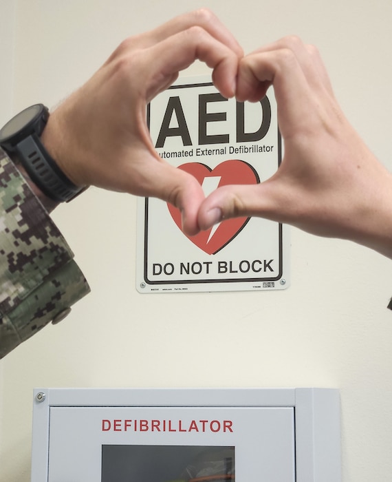 Heartfelt relocation… In a move to increase response time in providing life-saving treatment, automatic external defibrillators have been repositioned throughout Naval Hospital Bremerton near specific elevator bays in the command. In the event of a cardiac arrest, which creates a high-stress environment, it is best to remove the potential for human error by standardization of response including AED location,” explained Lt. Lauren P. Luscuskie, staff anesthesiologist and the command’s Cardiopulmonary Resuscitation Committee chair (Official Navy photo by Mass Communication Specialist 2nd Class Jennifer Benedict, public affairs office)