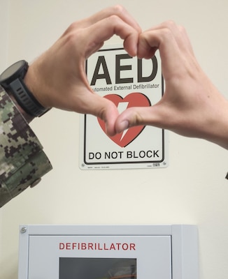 Heartfelt relocation… In a move to increase response time in providing life-saving treatment, automatic external defibrillators have been repositioned throughout Naval Hospital Bremerton near specific elevator bays in the command. In the event of a cardiac arrest, which creates a high-stress environment, it is best to remove the potential for human error by standardization of response including AED location,” explained Lt. Lauren P. Luscuskie, staff anesthesiologist and the command’s Cardiopulmonary Resuscitation Committee chair (Official Navy photo by Mass Communication Specialist 2nd Class Jennifer Benedict, public affairs office)