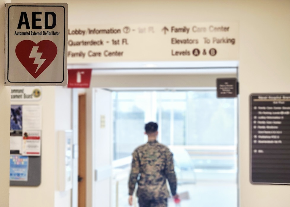 Get a charge out of this… In a move to increase response time in providing life-saving treatment, automatic external defibrillators have been repositioned throughout Naval Hospital Bremerton near specific elevator bays in the command. In the event of a cardiac arrest, which creates a high-stress environment, it is best to remove the potential for human error by standardization of response including AED location,” explained Lt. Lauren P. Luscuskie, staff anesthesiologist and the command’s Cardiopulmonary Resuscitation Committee chair (Official Navy photo by Mass Communication Specialist 2nd Class Jennifer Benedict, public affairs office)