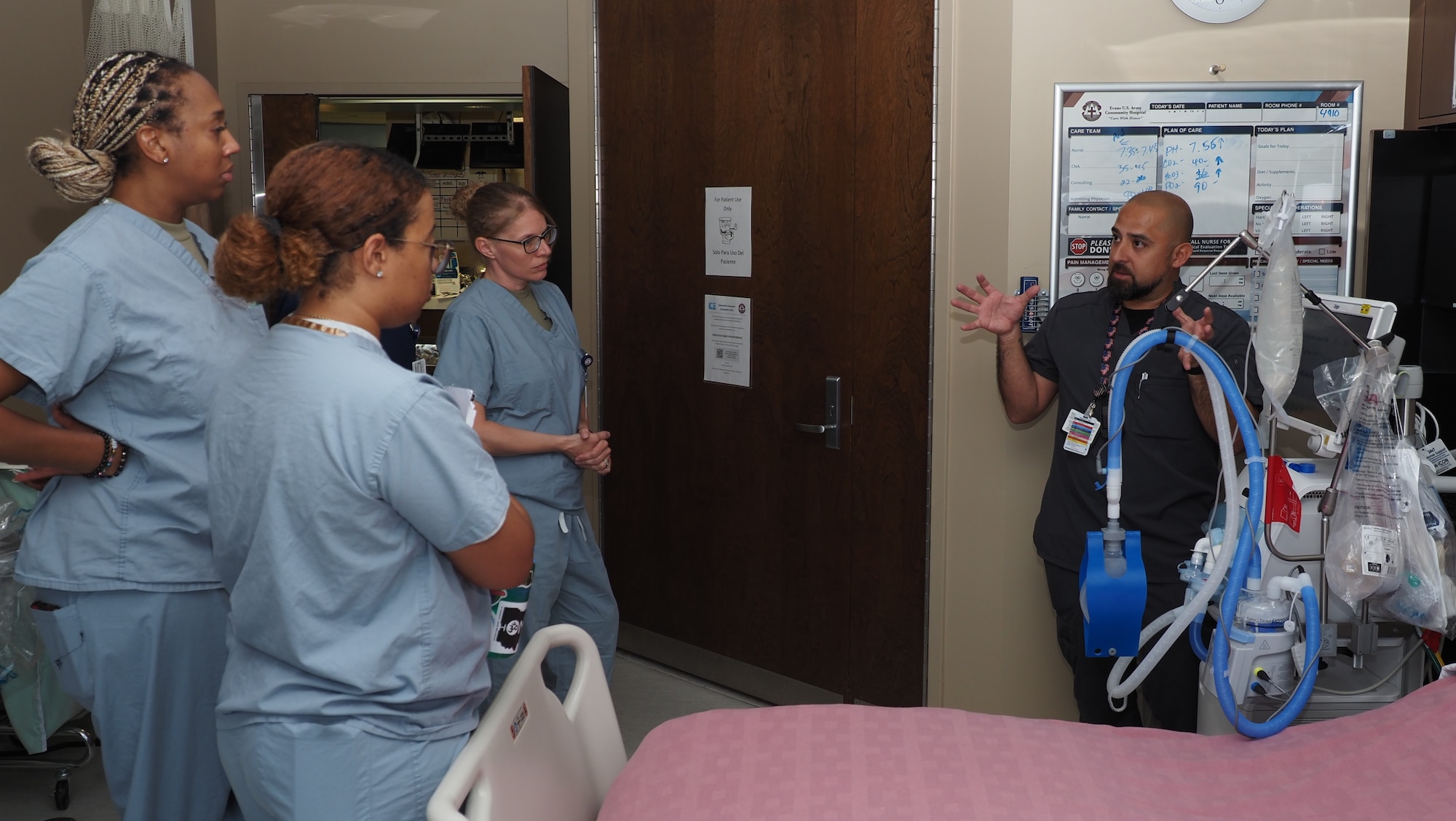 Gilbert Franco, an Evans Army Community Hospital respiratory therapist, provides ventilator training to Airmen from the 910th Medical Squadron from Youngstown Air Reserve Station, Ohio.