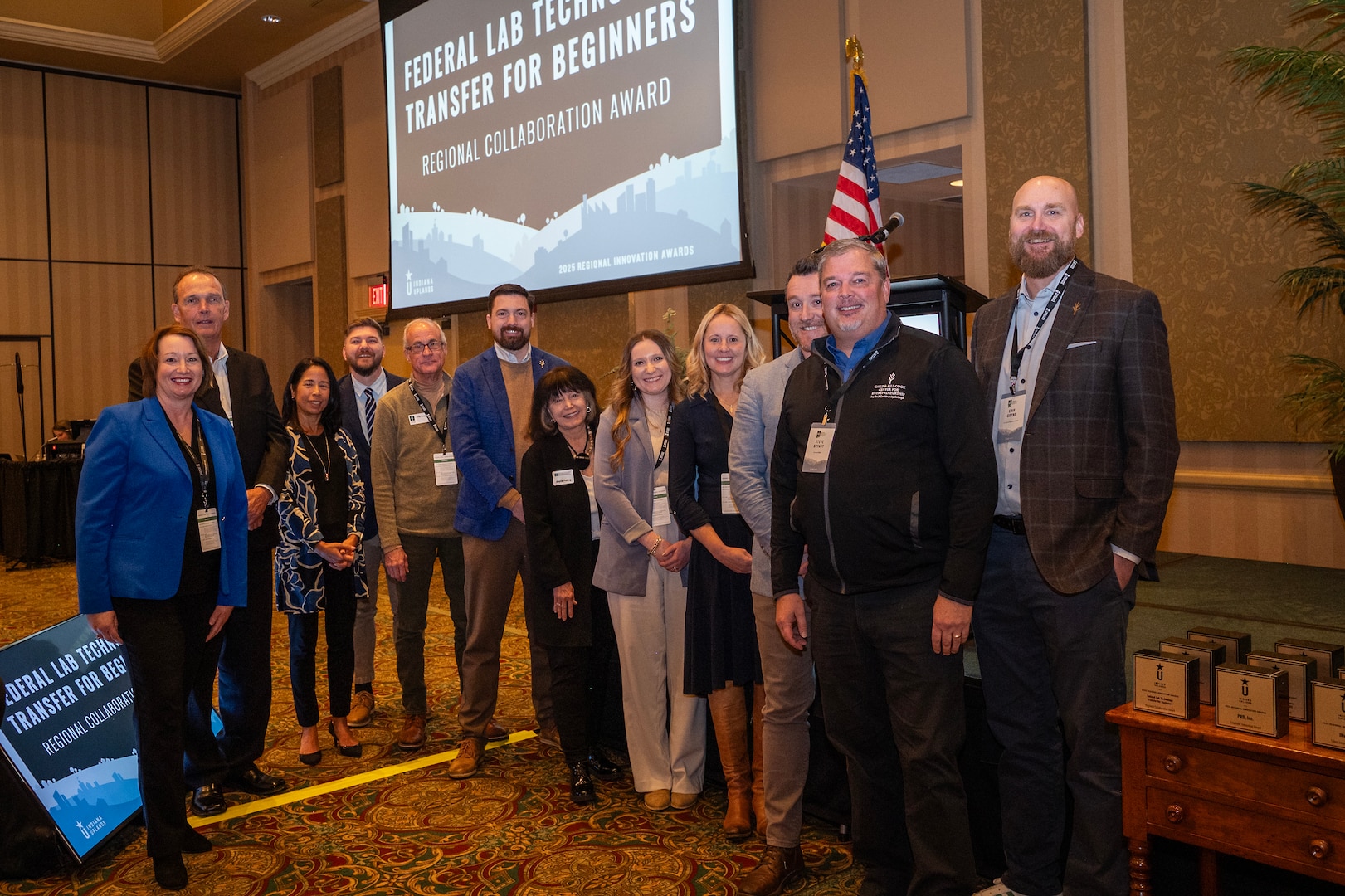 Photo courtesy of Regional Opportunity Initiative(ROI) including Defense Innovation Networking Group (DING), Ivy Tech Community College,  NSWC Crane, and ROI representative recognized with the Indiana Uplands Regional Collaboration Award for the Federal Lab Technology Transfer for Beginners course.