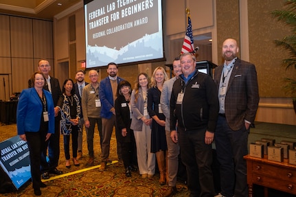 Photo courtesy of Regional Opportunity Initiative(ROI) including Defense Innovation Networking Group (DING), Ivy Tech Community College,  NSWC Crane, and ROI representative recognized with the Indiana Uplands Regional Collaboration Award for the Federal Lab Technology Transfer for Beginners course.