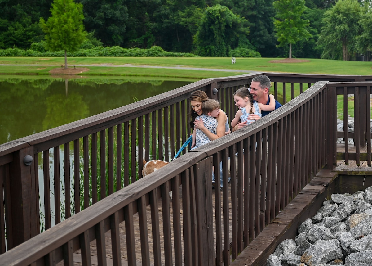 U.S. Air Force Capt. Melissa VanArtsdalen, Squadron Officer School instructor, and Maj. Ryan VanArtsdalen, Air Command and Staff College fellow, spend time with their children and family dog in Prattville, Alabama
