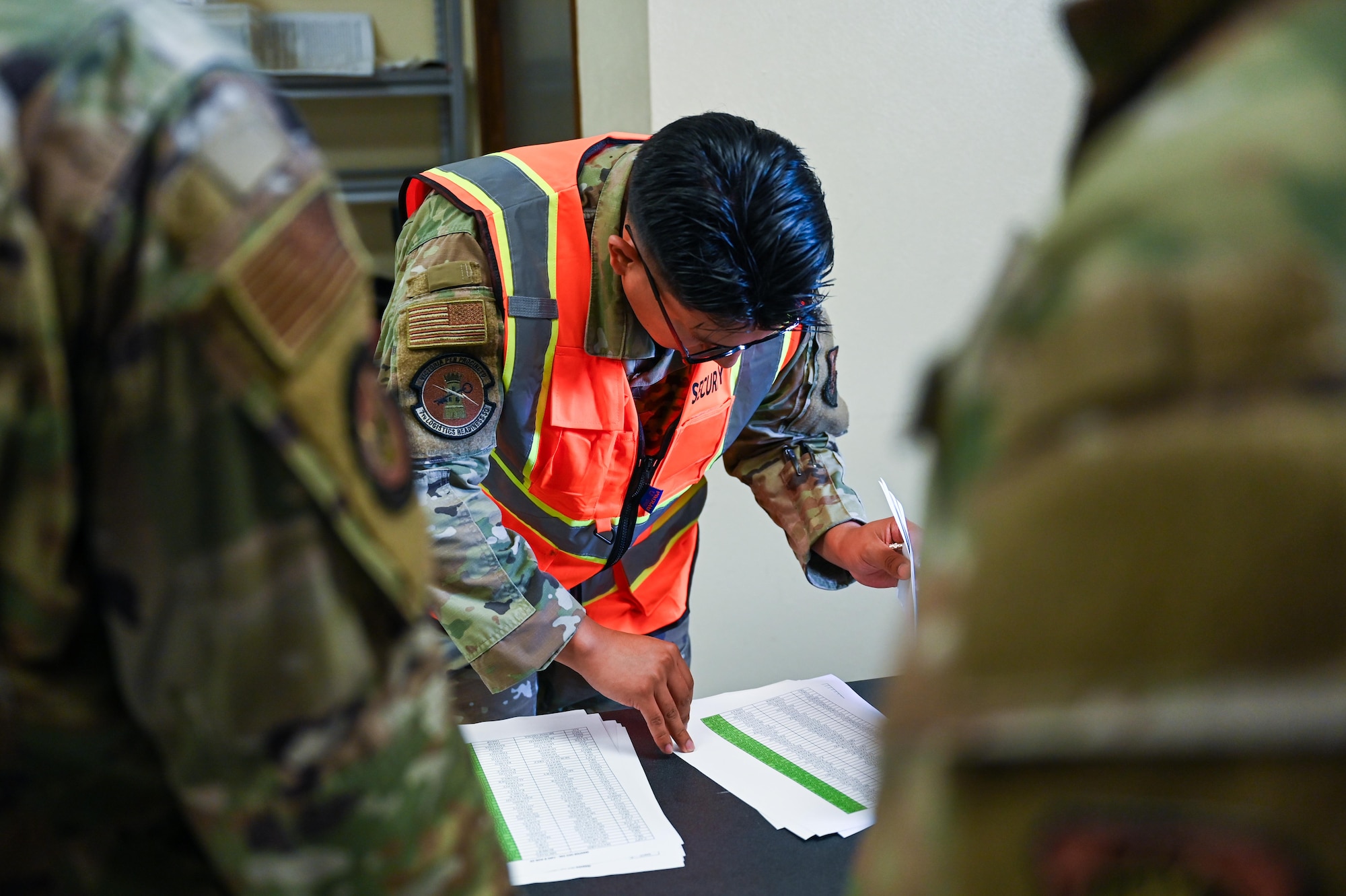 U.S. Air Force Airman 1st Class Christian Sanchez, 7th Logistics Readiness Squadron vehicle maintenance journeyman, checks an entry authorization list during a Combat Readiness Inspection at Dyess Air Force Base, Texas, July 1, 2025. The 317th Airlift Wing was evaluated by Air Mobility Command during its first graded CRI. (U.S. Air Force photo by Airman 1st Class Adrien Tran)