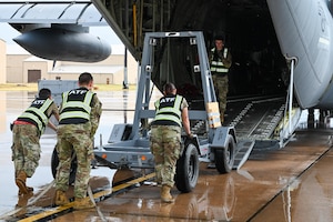 U.S. Air Force Airmen from the 7th Logistics Readiness Squadron load an engine trailer onto a C-130J Super Hercules during a Combat Readiness Inspection at Dyess AFB, Texas, July 1, 2025. The coordinated deployment and training exercise provided Airmen opportunities to move fast and think critically and creatively to maintain rapid deployment capabilities and mission readiness. (U.S. Air Force photo by Airman 1st Class Adrien Tran)