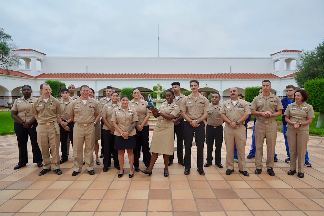 250709-N-FT324-1087. ROTA, Spain (July 9, 2025). U.S. Naval Hospital Rota’s Surgical Services team were recently presented the Association of periOperative Registered Nurses (AORN) Go Clear Award, marking a historic achievement as the first Military Treatment Facility (MTF) in the U.S. European Command (EUCOM) to earn this prestigious national certification for eliminating surgical smoke in operating rooms. (U.S. Navy Photo Released by Lt. Cmdr. Alicia Sacks)