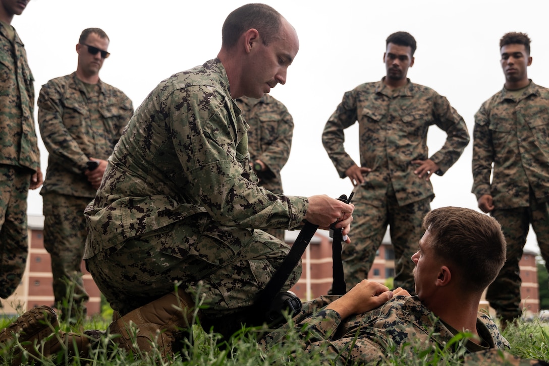 U.S. Navy Chief Petty Officer Scott Musolf (center left), a chief hospital corpsman attached with Marine Wing Support Squadron 471 provides triage guidance in a combat lifesaver (CLS) course during Atlantic Alliance 25 at Fort Drum, New York, July 8, 2025.