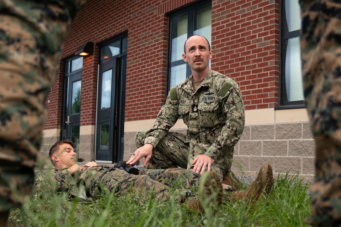 U.S. Navy Chief Petty Officer Scott Musolf (center right), a chief hospital corpsman attached with Marine Wing Support Squadron 471 provides triage guidance in a combat lifesaver (CLS) course during Atlantic Alliance 25 at Fort Drum, New York, July 8, 2025.