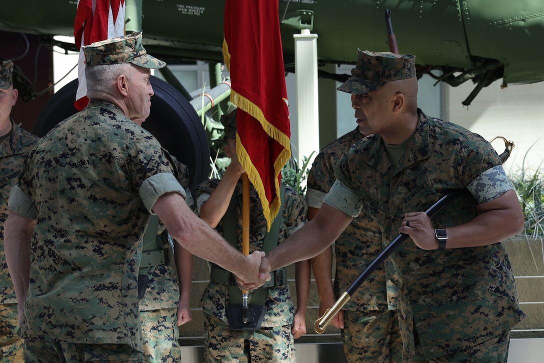 U.S. Marine Corps Maj. Gen. William J. Bowers, commanding general of Marine Corps Recruiting Command, left, congratulates Sgt. Maj. Jesse J. Dorsey Jr., right, incoming MCRC sergeant major, during the MCRC Sergeant Major Relief and Appointment ceremony at the National Museum of the Marine Corps in Triangle, Va., July 9, 2025. Goodyear served as MCRC’s Sergeant Major for 2 years and will become Marine Corps Forces Central Command’s Sergeant Major.(U.S. Marine Corps photo by Lance Cpl. Brenna Ritchie)
