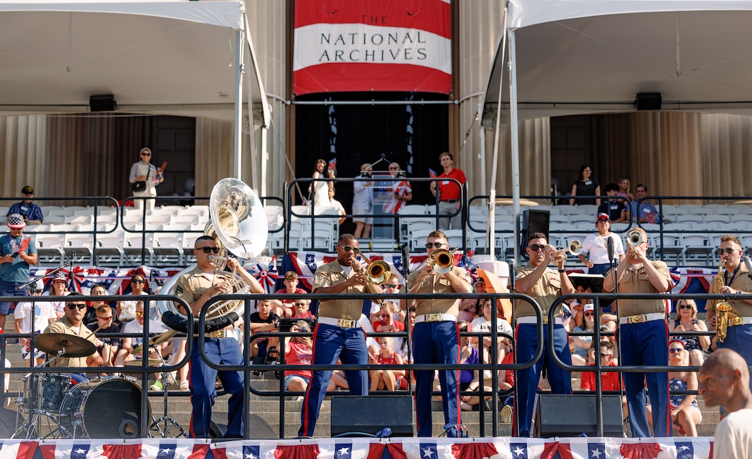 U.S. Marines with the Quantico Marine Brass Band perform at the National Archives Museum, Washington D.C., July 4, 2025. The band performed as a feature event to kick off the Independence Day Parade in Washington D.C. to celebrate the 249th anniversary of America’s independence. (U.S. Marine Corps photo by Lance Cpl. Braydon Rogers)