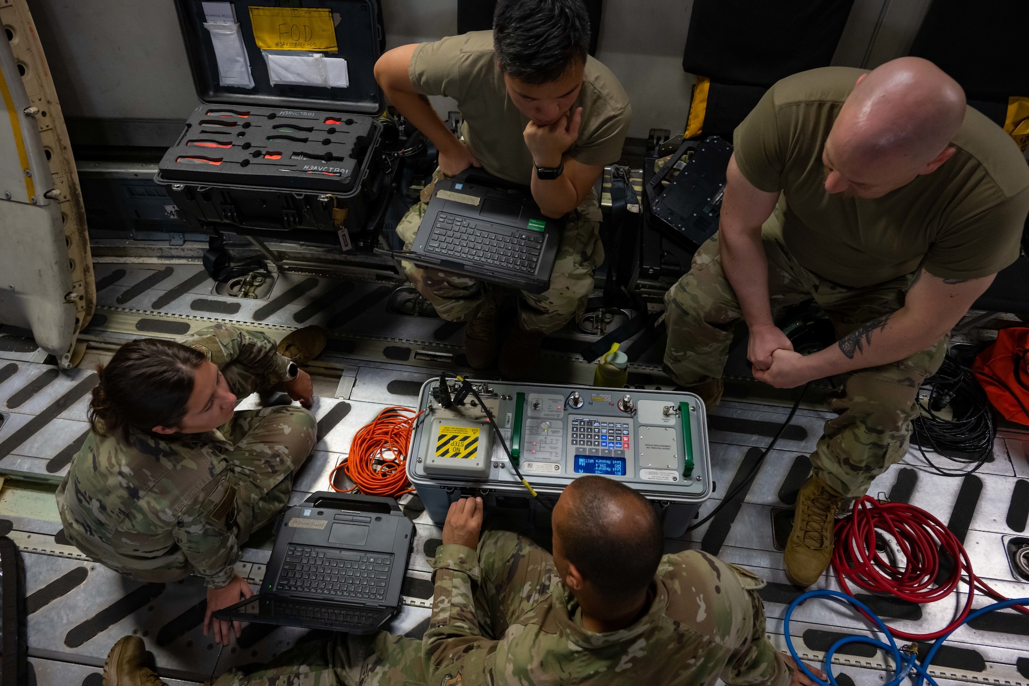 Airmen from the 105th Aircraft Maintenance Squadron and U.S. Air Force Reserve 315th Aircraft Maintenance Squadron work on a C-17 Globemaster III.