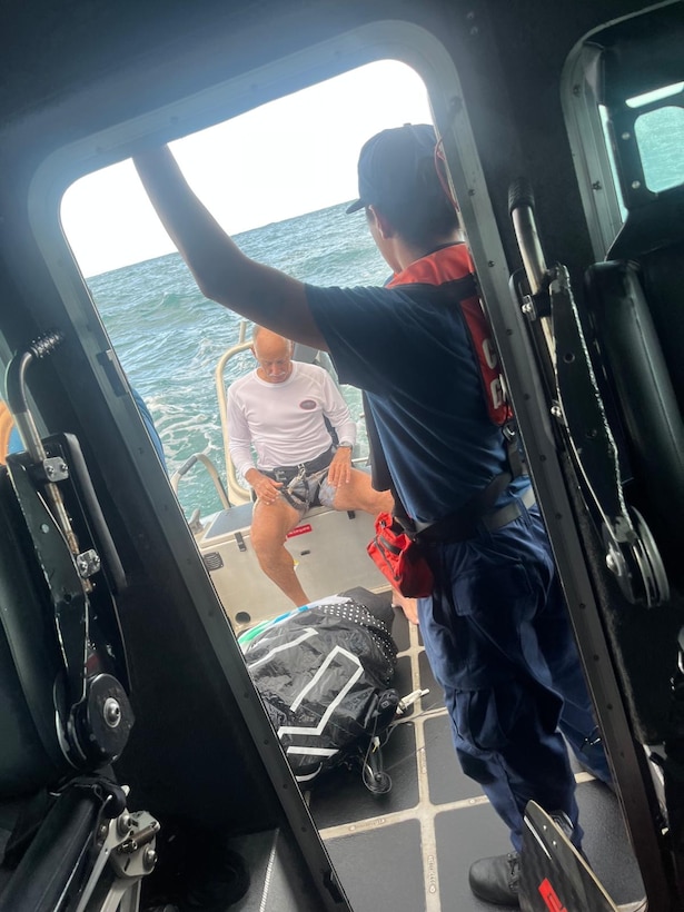 A kite surfer who was beset by weather is aboard a Coast Guard Station San Juan 33-foot Special Purpose Craft after being rescued off Ocean Park Beach in San Juan, Puerto Rico, Tuesday evening.  The Coast Guard boat crew rescued one other kite surfer, while a responding Puerto Rico Police marine unit rescued four others. No injuries were reported in this case. (U.S. Coast Guard photo)