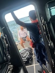A kite surfer who was beset by weather is aboard a Coast Guard Station San Juan 33-foot Special Purpose Craft after being rescued off Ocean Park Beach in San Juan, Puerto Rico, Tuesday evening.  The Coast Guard boat crew rescued one other kite surfer, while a responding Puerto Rico Police marine unit rescued four others. No injuries were reported in this case. (U.S. Coast Guard photo)