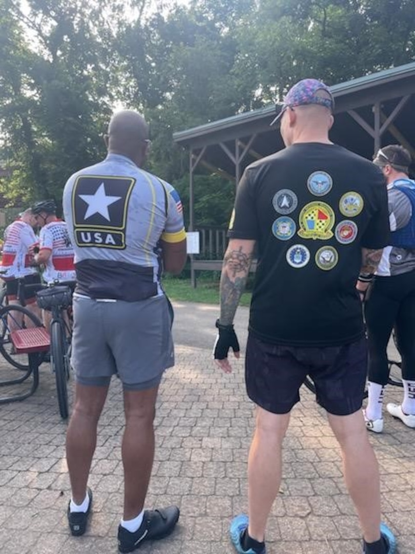 Army Maj. Amaquah Bonsu (left), Pittsburgh MEPS commander, and Army Capt. Nate Wilson (right), Pittsburgh MEPS operations officer, wear US Army and USMEPCOM apparel while supporting a charity bike ride to support veterans. Bonsu and Wilson participated in the annual 60 Miles for Veterans charity bike ride in Connellsville, Pa. raising more than $2,300 for local veterans.