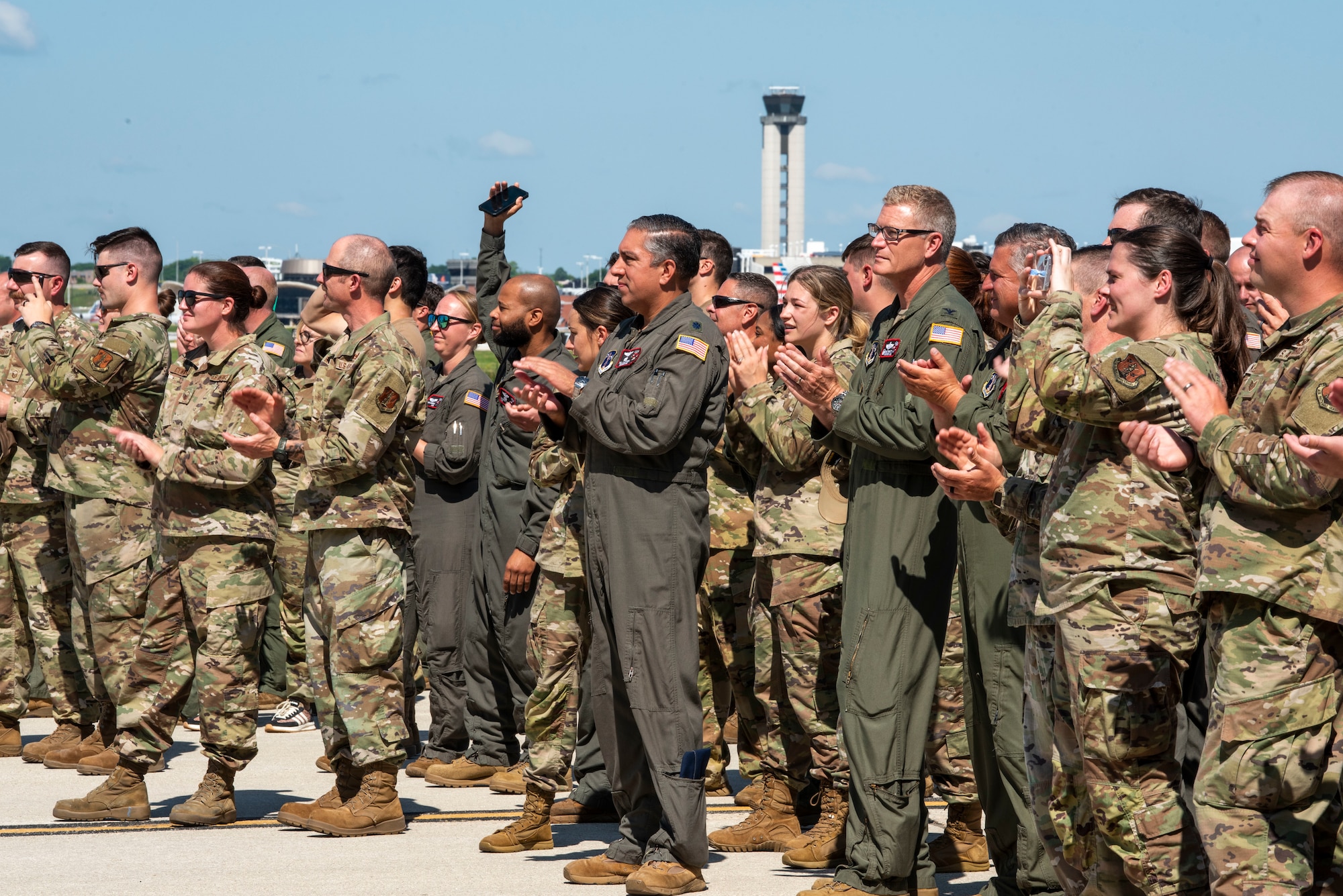 U.S. Air Force Airmen assigned to the 128th Air Refueling Wing, clap as the KC-135 Command Jet taxis out of the hangar to unveil its new heritage design, General Mitchell Air National Guard Base, Milwaukee, WI, July 1, 2025. The custom heritage design pays tribute to the wing’s legacy while celebrating its continued mission readiness. (U.S. Air National Guard photo by Airman 1st Class Cynthia Yang, 128th Air Refueling Wing Public Affairs Specialist)