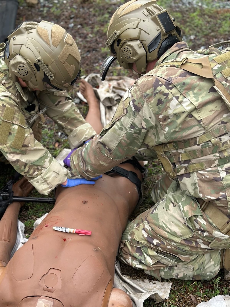Image of two Airmen training.