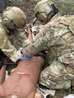 Image of two Airmen training.