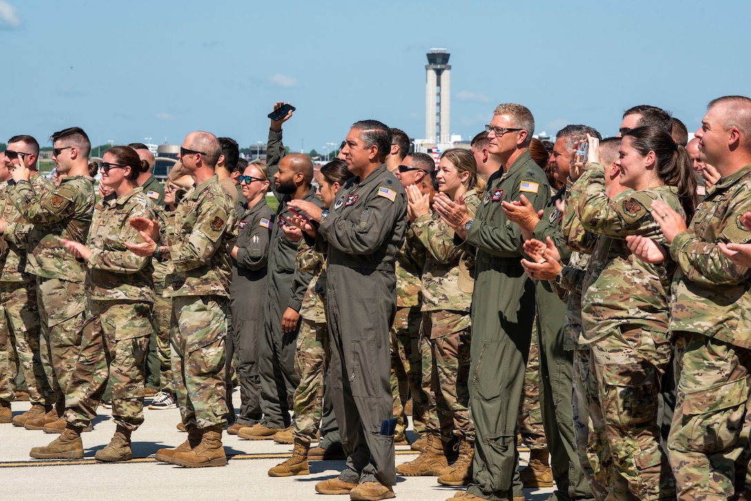 U.S. Air Force Airmen assigned to the 128th Air Refueling Wing, clap as the KC-135 Command Jet taxis out of the hangar to unveil its new heritage design, General Mitchell Air National Guard Base, Milwaukee, WI, July 1, 2025. The custom heritage design pays tribute to the wing’s legacy while celebrating its continued mission readiness. (U.S. Air National Guard photo by Airman 1st Class Cynthia Yang, 128th Air Refueling Wing Public Affairs Specialist)