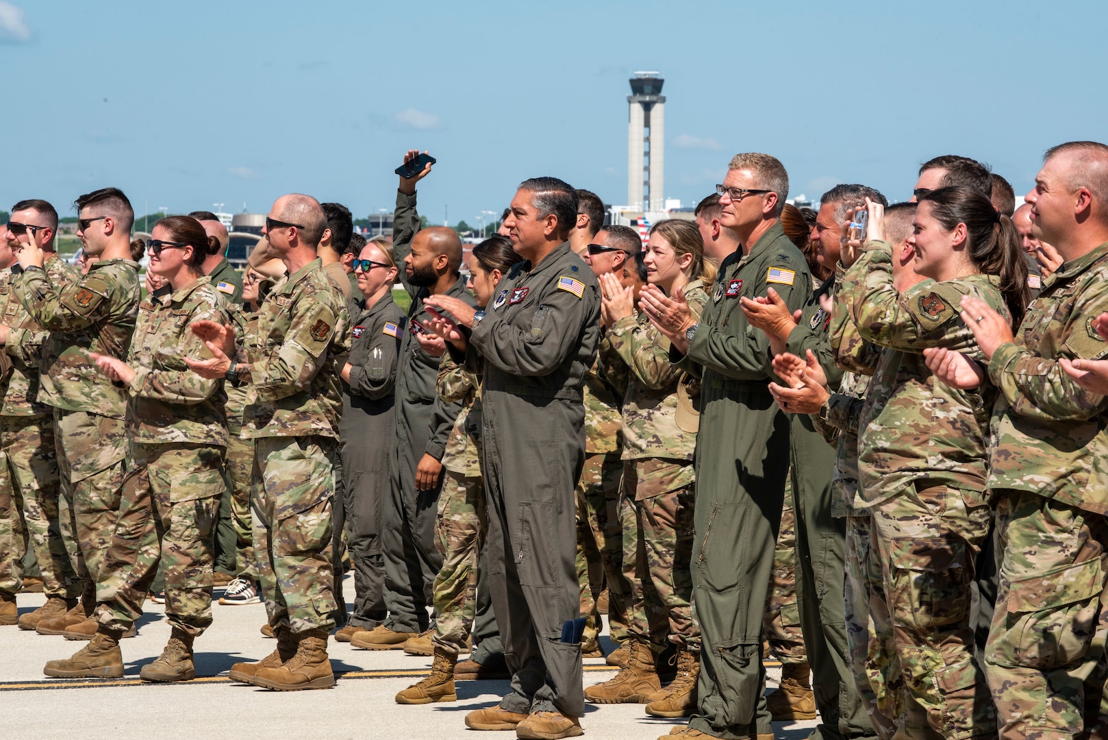 U.S. Air Force Airmen assigned to the 128th Air Refueling Wing, clap as the KC-135 Command Jet taxis out of the hangar to unveil its new heritage design, General Mitchell Air National Guard Base, Milwaukee, WI, July 1, 2025. The custom heritage design pays tribute to the wing’s legacy while celebrating its continued mission readiness. (U.S. Air National Guard photo by Airman 1st Class Cynthia Yang, 128th Air Refueling Wing Public Affairs Specialist)