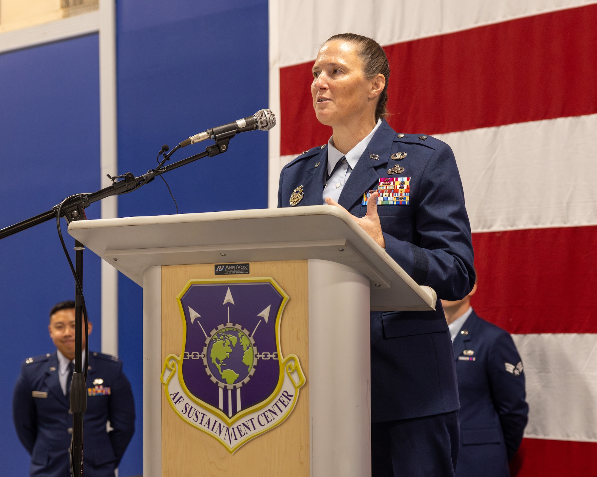 Woman stands at podium