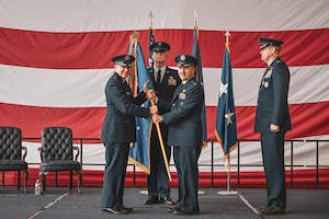 A guidon is passed during a change of command ceremony.