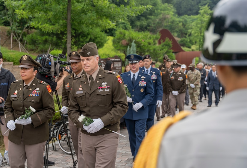 Col. Rosann Clemente, 35th Air Defense Artillery Brigade commander, and Col. James Peay, Eighth Army G3, participate in the 75th Task Force Memorial Ceremony at the Jukmiryeong War Memorial in Osan, South Korea, July 3, 2025.