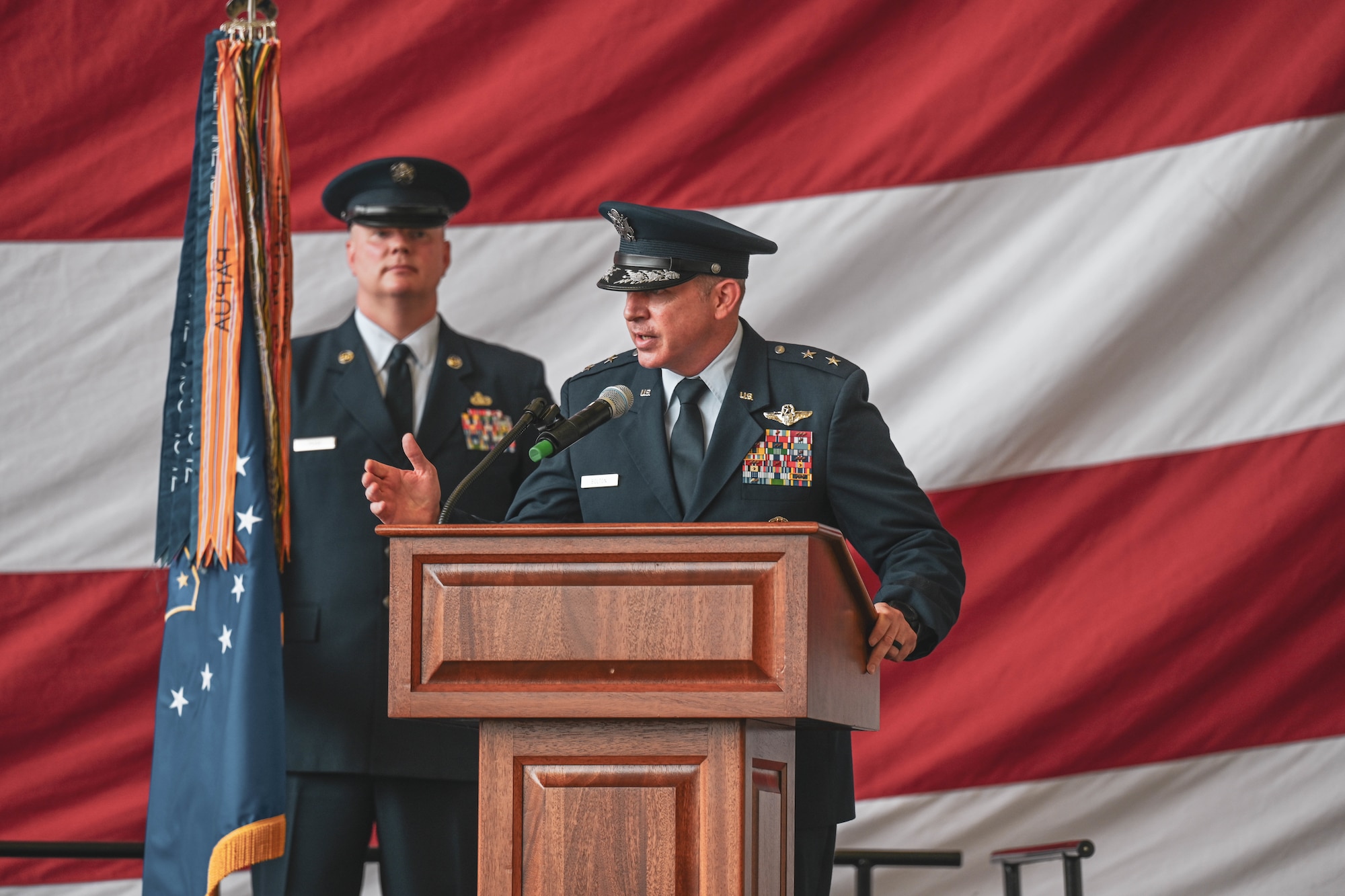 A commander gives remarks during a ceremony.