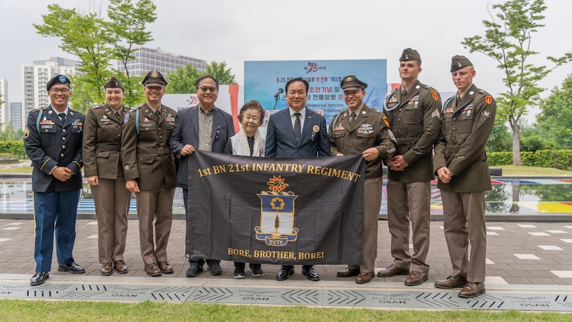 U.S. Army Soldiers from the 25th Infantry Division based out of Hawaii pose with Lee, Kwon Jae, mayor of Osan city, and distinguish visitors during the 75th Task Force Memorial Ceremony at the Jukmiryeong War Memorial in Osan, South Korea, July 3, 2025.