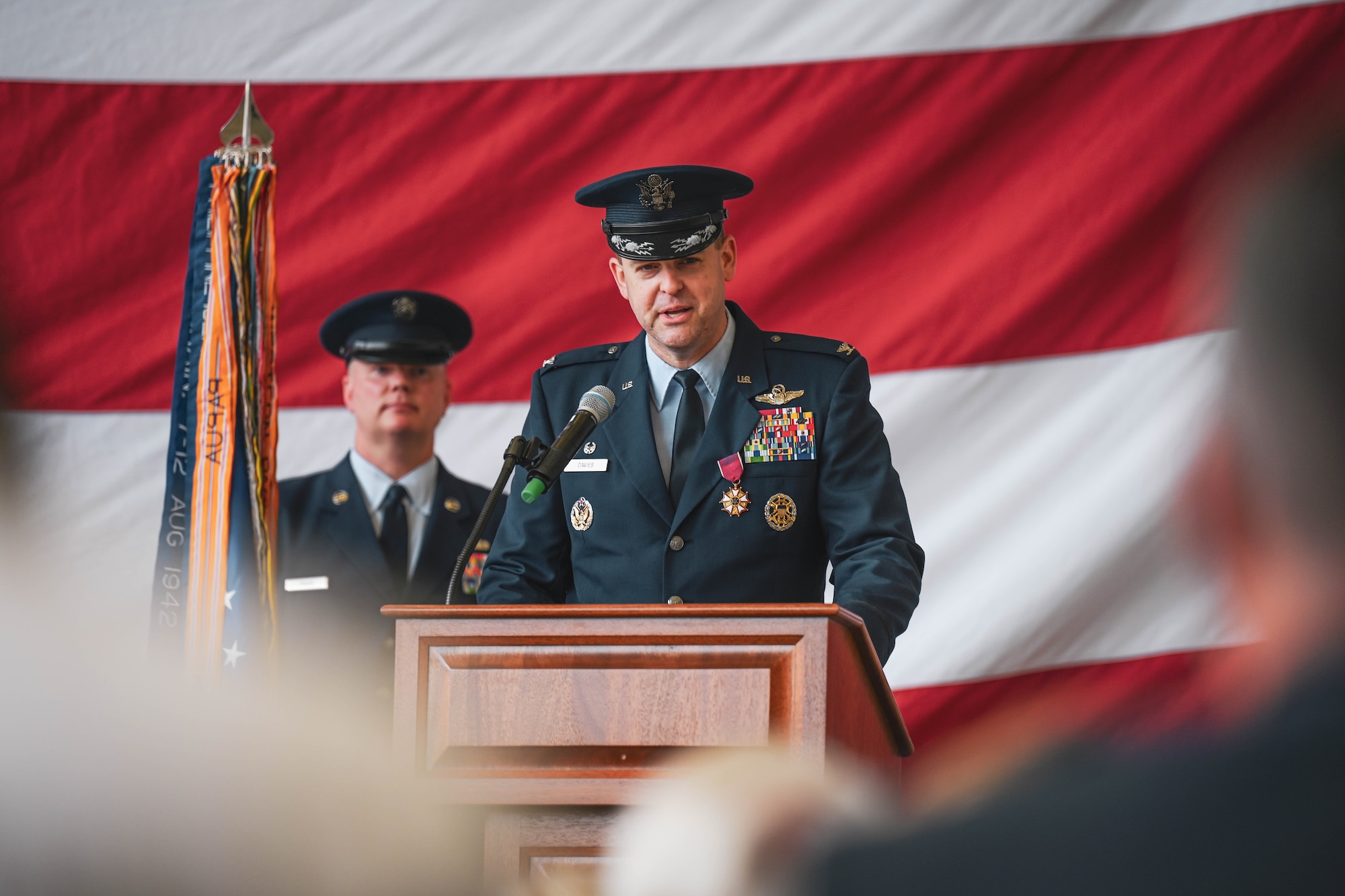 A commander gives a speech during a ceremony.