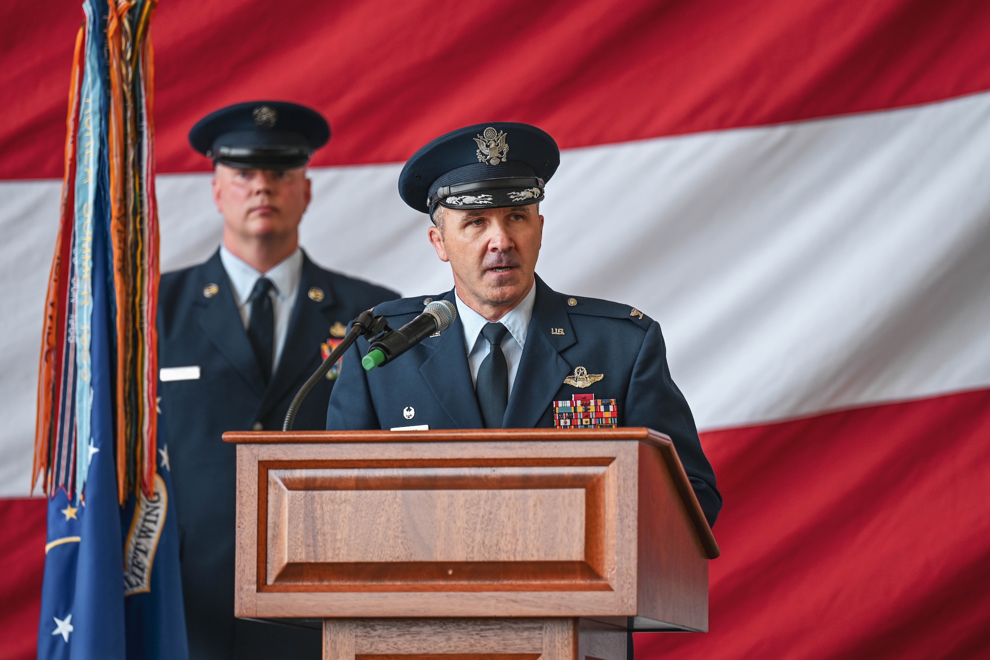 A commander gives a speech during a ceremony.