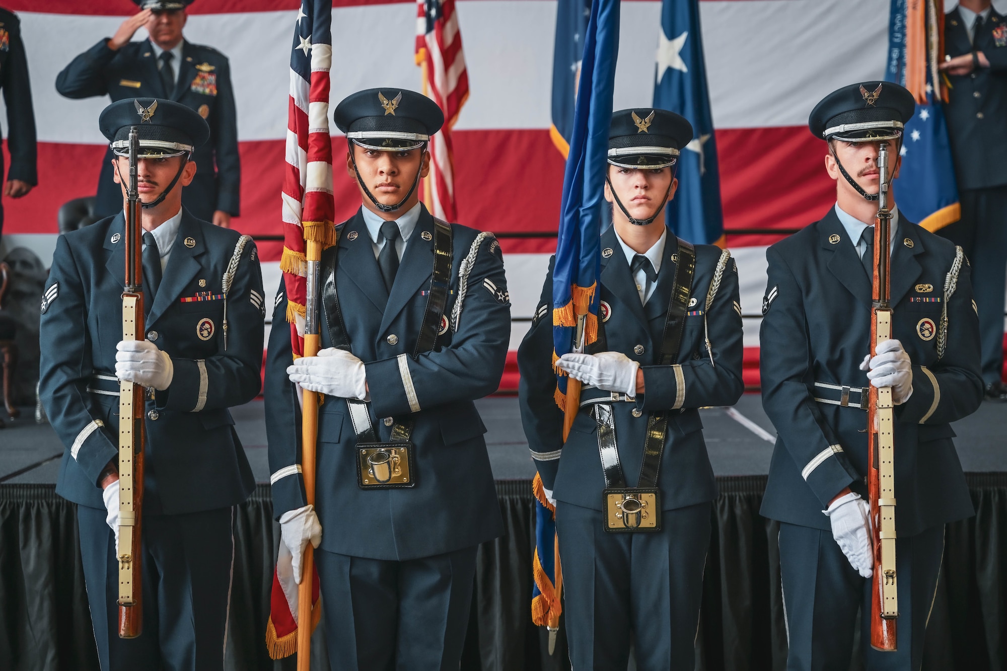 The Little Rock Air Force Base Honor Guard presents the colors during a ceremony.