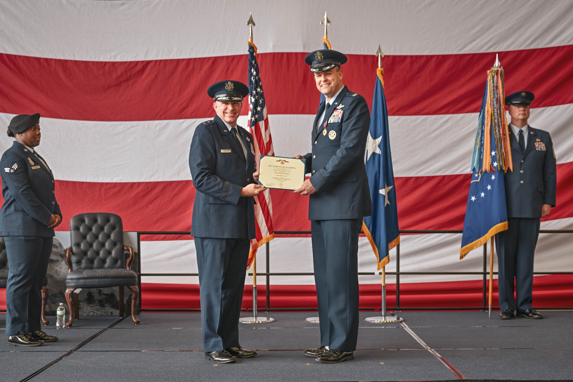 A commander is presented with the Legion of Merit during a change of command ceremony.