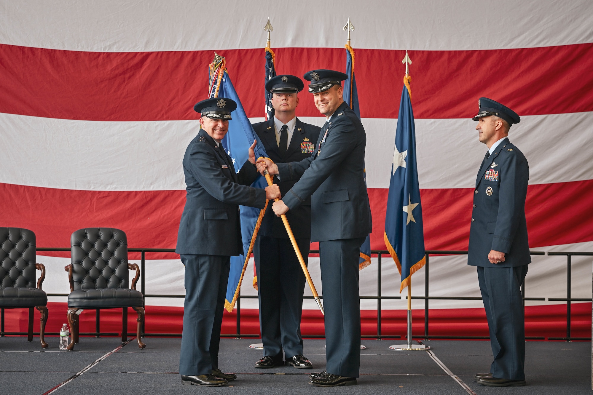 A guidon is passed during a change of command ceremony.